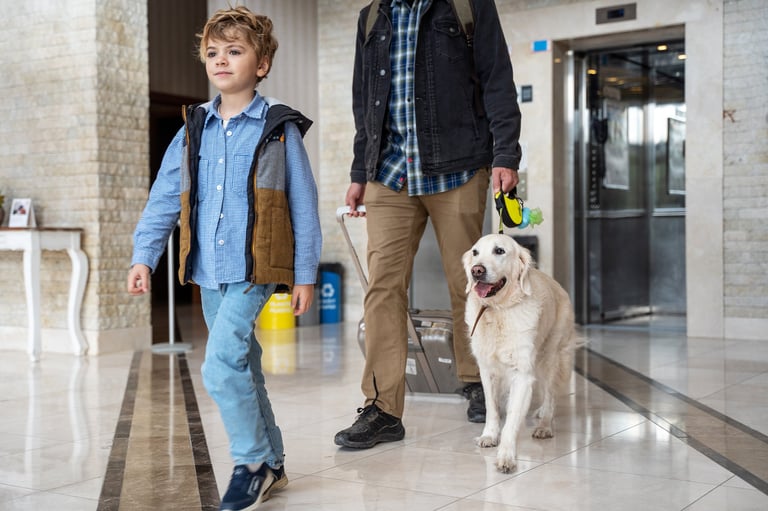 Family with golden retriever at hotel