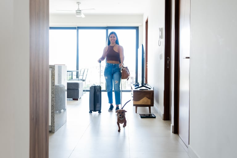 Woman with dachshund traveling